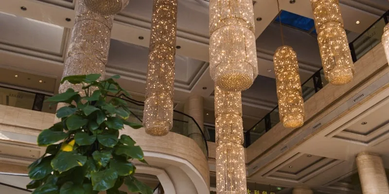 Grand hotel lobby with ornate chandeliers